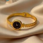gold-colored watch bracelet